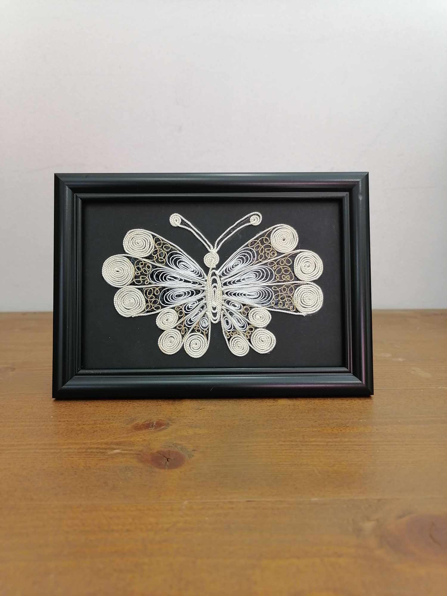 Picture of butterfly in filigree technique