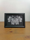 Picture of butterfly in filigree technique