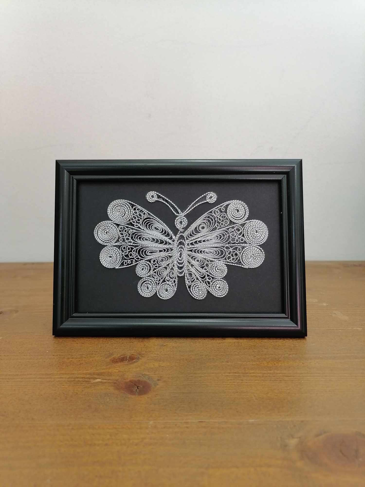 Picture of butterfly in filigree technique