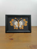 Picture of butterfly in filigree technique