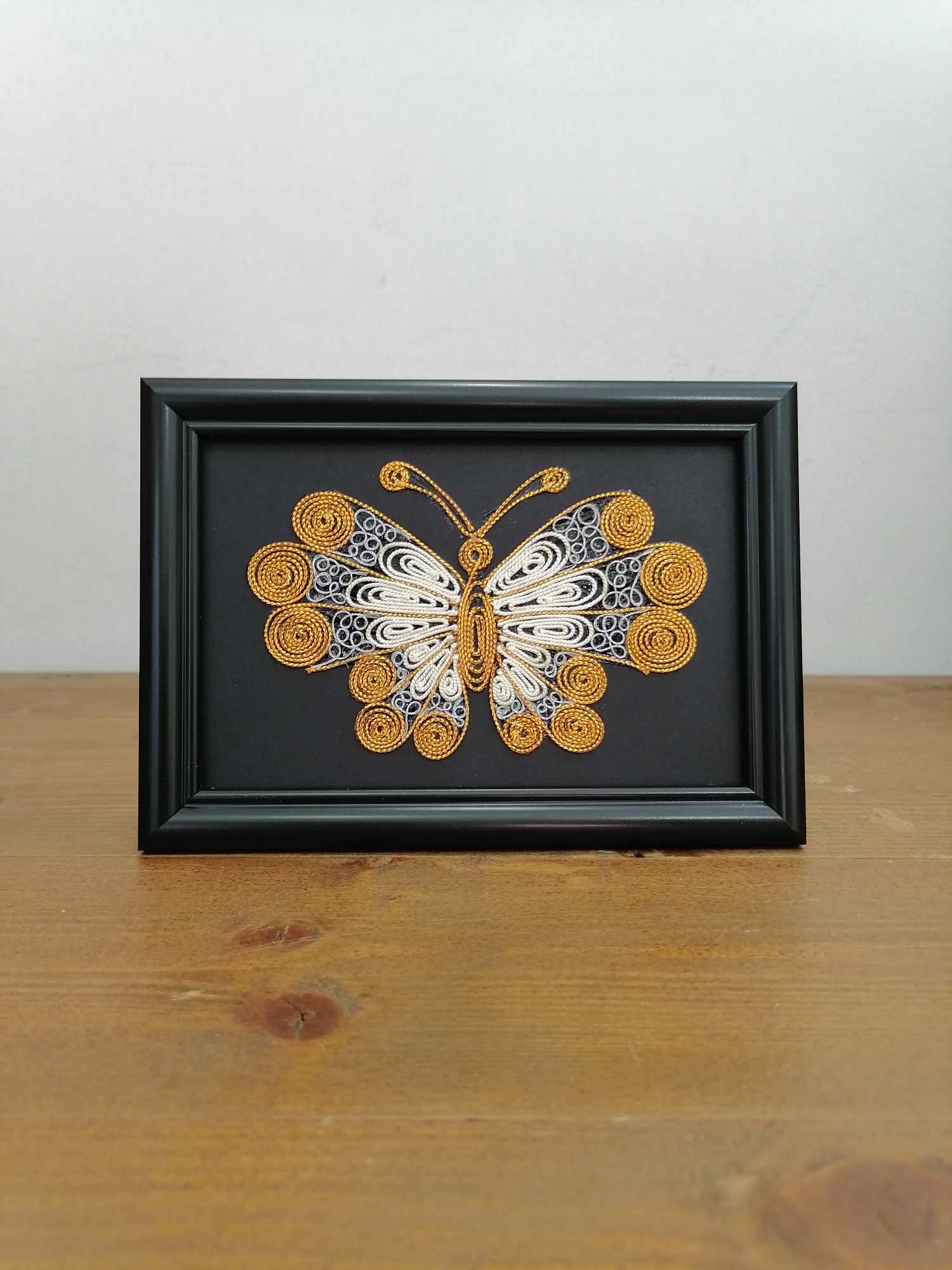 Picture of butterfly in filigree technique