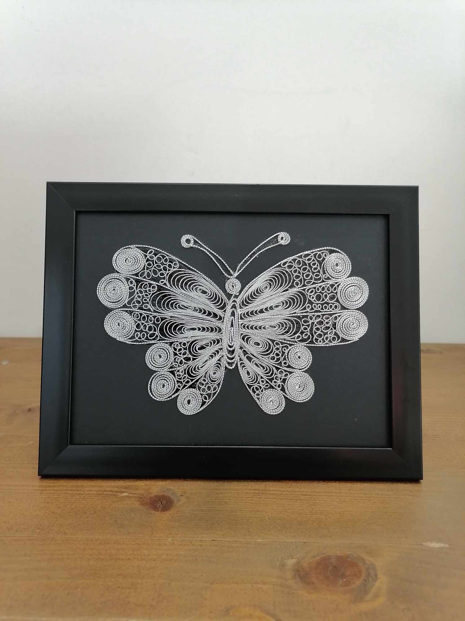 Picture of butterfly in filigree technique